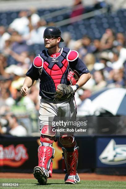 Brian McCann of the Atlanta Braves catches during the game against the San Diego Padres at Petco Park on August 5, 2009 in San Diego, California. The...