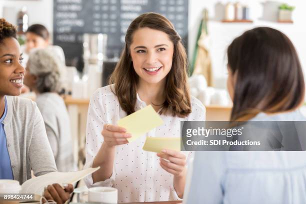 young woman reviews for exam with friends - flash card stock pictures, royalty-free photos & images