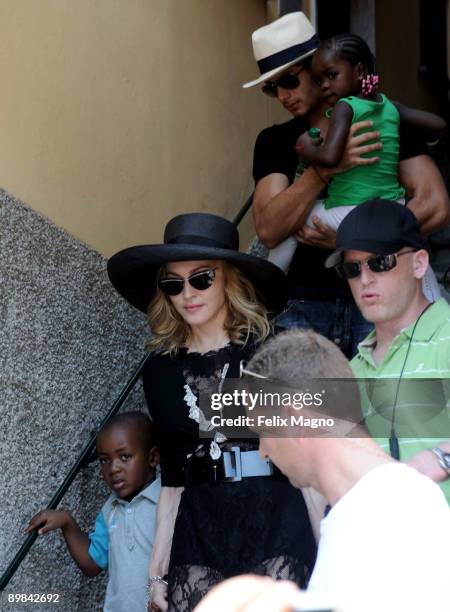 Jesus Luz holding Mercy James and Madonna with son David Banda are sighted on August 17, 2009 in Portofino, Italy.