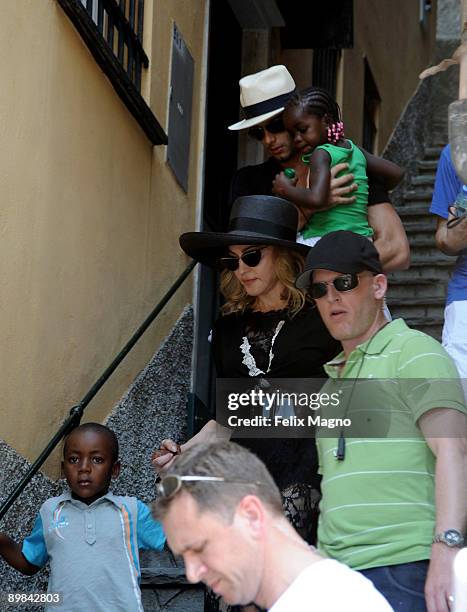 Jesus Luz holding Mercy James and Madonna with son David Banda are sighted on August 17, 2009 in Portofino, Italy.