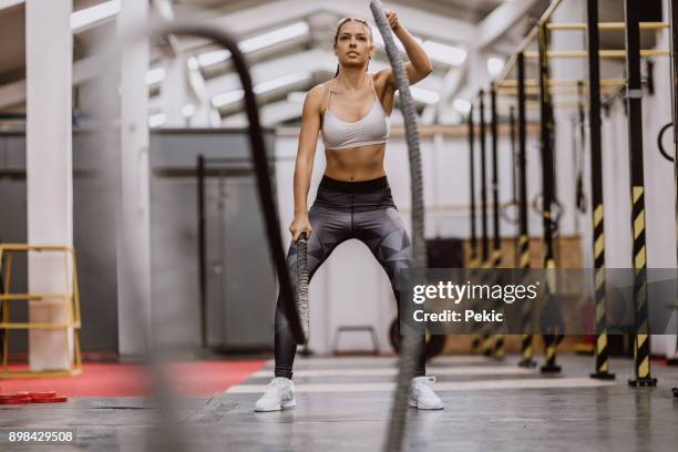 body building battle ropes - leggings stock pictures, royalty-free photos & images