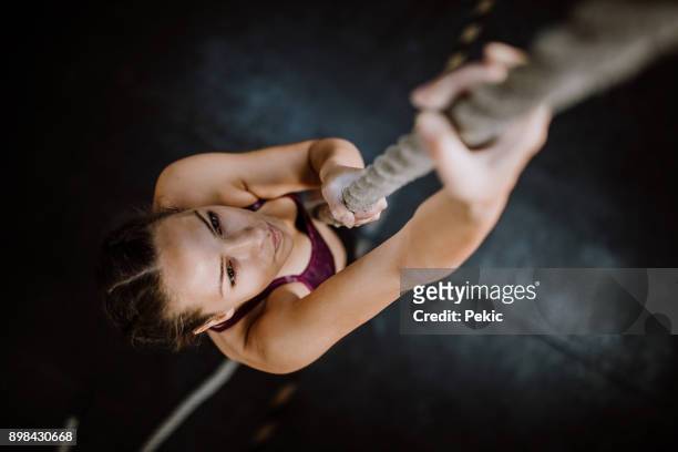young climber - battle rope stock pictures, royalty-free photos & images