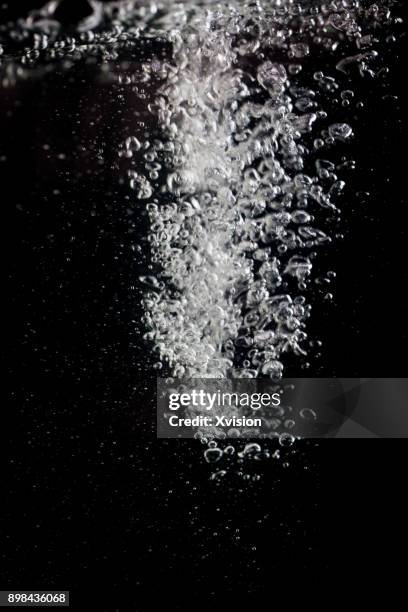 air bubble in the water in crash with black background studio shot - underwater splash stock pictures, royalty-free photos & images