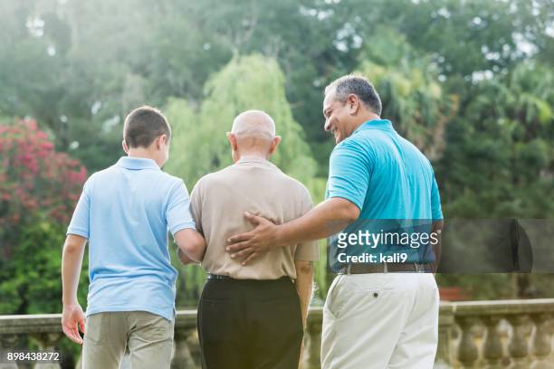 multi-generation hispanic family, 90 year old - arm in arm stock pictures, royalty-free photos & images