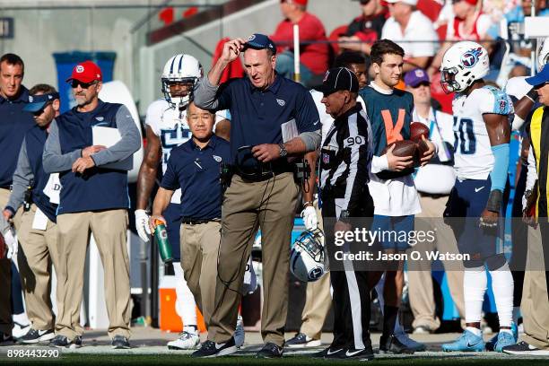 Head coach Mike Mularkey of the Tennessee Titans argues a call with line judge Mike Spanier during the second quarter against the San Francisco 49ers...