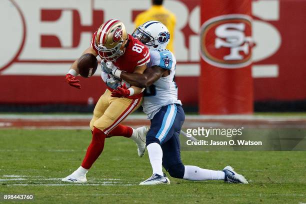 Wide receiver Trent Taylor of the San Francisco 49ers is tackled by cornerback Brice McCain of the Tennessee Titans during the fourth quarter at...