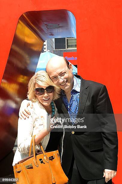 Television personality Joan Rivers poses with Norm Zada of Perfect 10 Magazine at the LOVE statue on the streets of Manhattan on August 17, 2009 in...