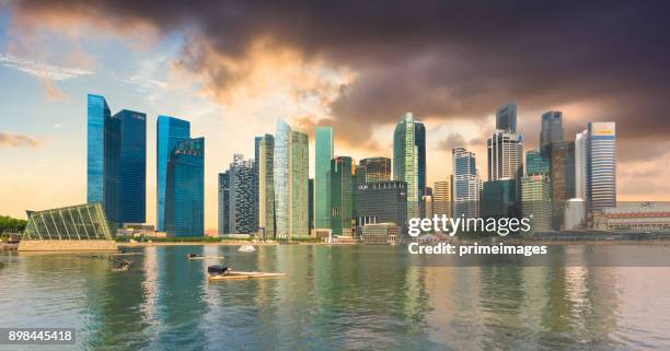 view of the skyline of singapore downtown cbd - merlion park stock pictures, royalty-free photos & images