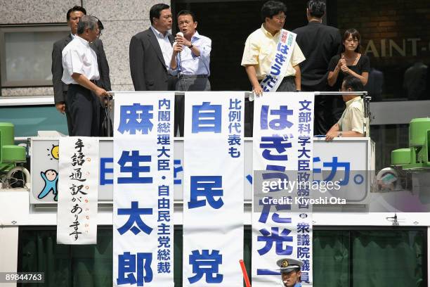 Prime Minister and President of the Liberal Democratic Party Taro Aso , delivers a stump speech during an election campaign in front of Hachioji...