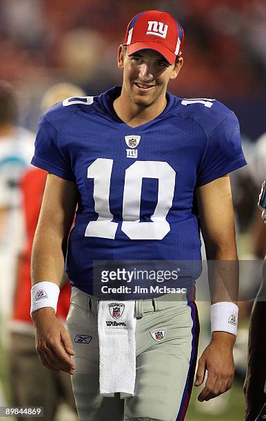 Eli Manning of the New York Giants walks off the field after a preseason NFL game against the Carolina Panthers on August 17, 2009 at Giants Stadium...