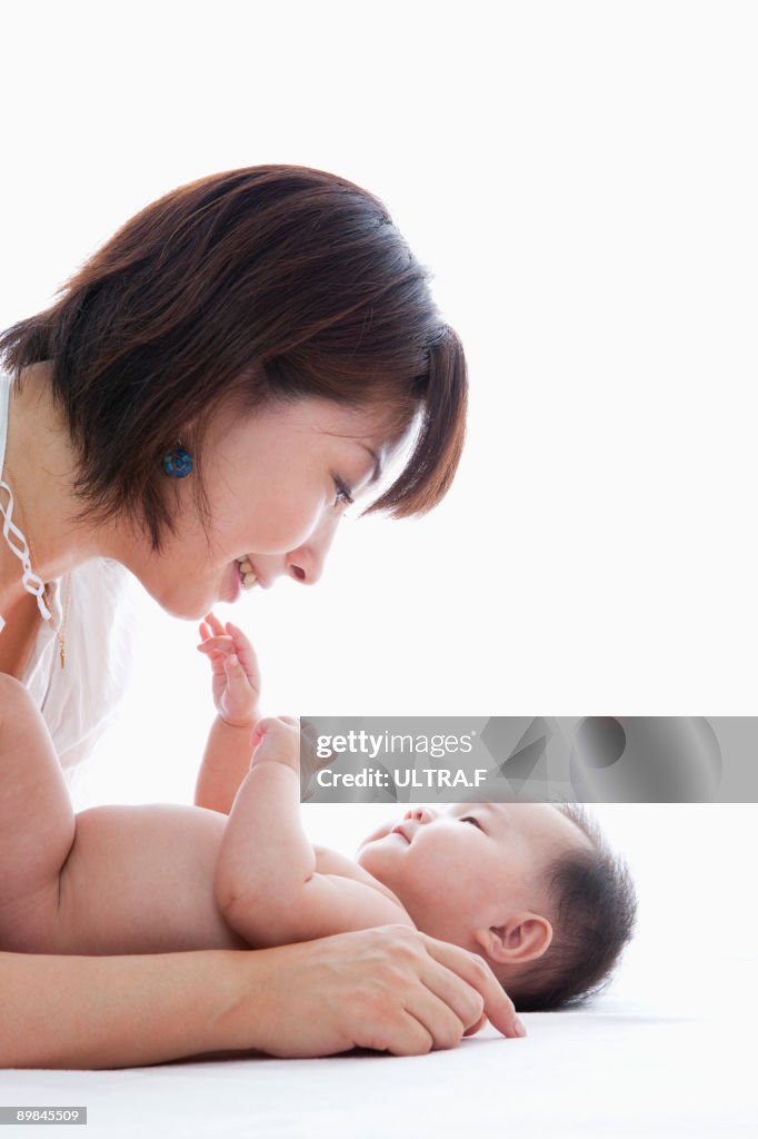 A mother talking to her baby.