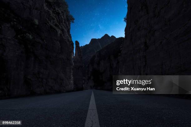 the starry sky in the valley - mountain roads stock pictures, royalty-free photos & images