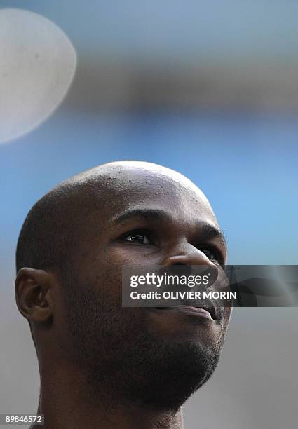 Saint Kitts and Nevis' Kim Collins reacts after competing in the men's 200m round 1 heat 9 race of the 2009 IAAF Athletics World Championships on...