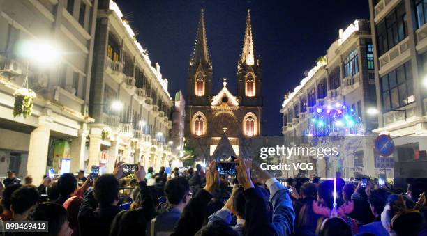 Chinese people attends a Christmas Eve mass in front of a church on December 24, 2017 in Guangzhou, China.