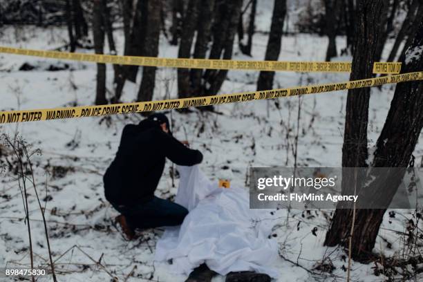 crime scene - identifying dead person in a snow - murder victim stock pictures, royalty-free photos & images