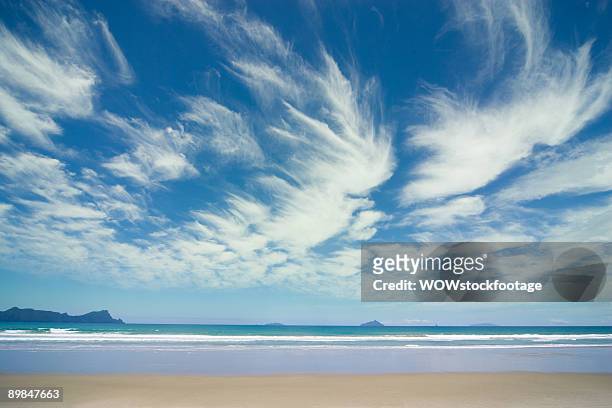 mares tail clouds at beach - wispy stock pictures, royalty-free photos & images