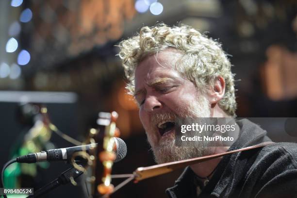 Glen Hansard takes part in the annual Christmas Eve busk in aid of the Dublin Simon Community outside the Gaiety Theater in Dublin. Hundreds attended...