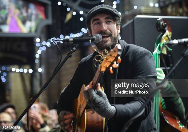 Danny O'Reilly from the Coronas takes part in the annual Christmas Eve busk in aid of the Dublin Simon Community outside the Gaiety Theater in...