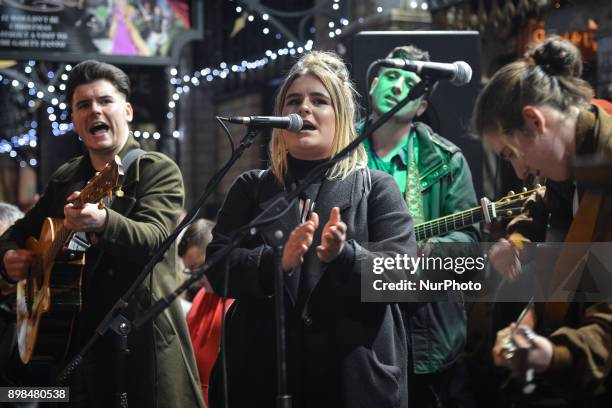 Young Irish musicians join Glen Hansard and take part in the annual Christmas Eve busk in aid of the Dublin Simon Community outside the Gaiety...