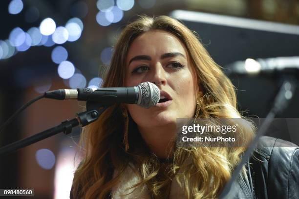 Roisin O takes part in the annual Christmas Eve busk in aid of the Dublin Simon Community outside the Gaiety Theater in Dublin. Hundreds attended the...