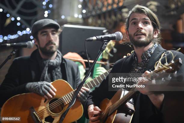 Danny O'Reilly from the Coronas and Harry Hudson Taylor perform together during the annual Christmas Eve busk in aid of the Dublin Simon Community...
