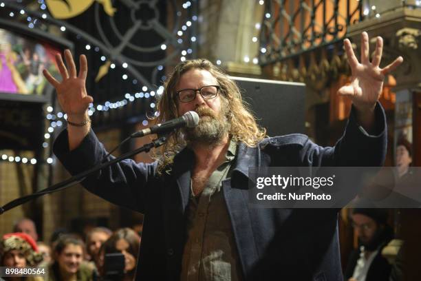 Liam O Maonlai takes part in the annual Christmas Eve busk in aid of the Dublin Simon Community outside the Gaiety Theater in Dublin. Hundreds...