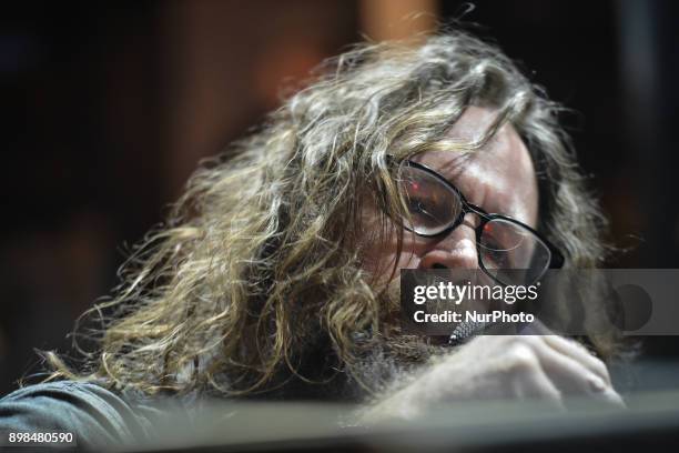 Liam O Maonlai takes part in the annual Christmas Eve busk in aid of the Dublin Simon Community outside the Gaiety Theater in Dublin. Hundreds...