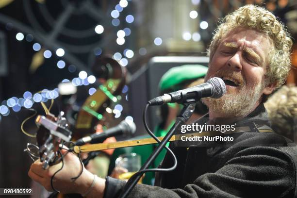 Glen Hansard takes part in the annual Christmas Eve busk in aid of the Dublin Simon Community outside the Gaiety Theater in Dublin. Hundreds attended...