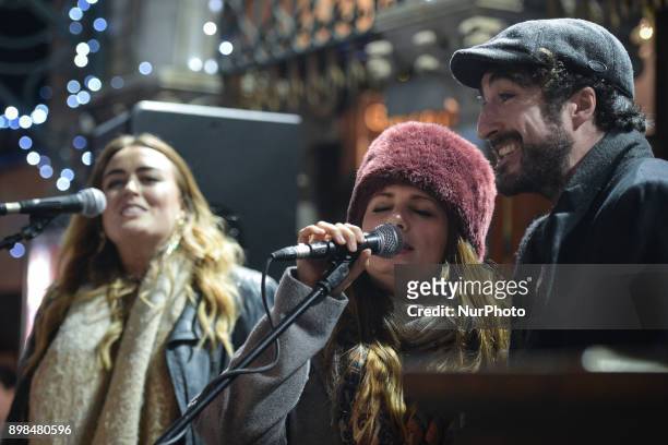 Roisin O and Danny O'Reilly of Coronas take part in the annual Christmas Eve busk in aid of the Dublin Simon Community outside the Gaiety Theater in...