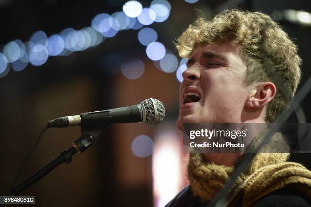 David Keenan takes part in the annual Christmas Eve busk in aid of the Dublin Simon Community outside the Gaiety Theater in Dublin. Hundreds attended...