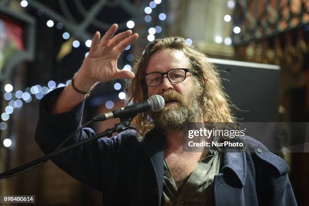 Liam O Maonlai takes part in the annual Christmas Eve busk in aid of the Dublin Simon Community outside the Gaiety Theater in Dublin. Hundreds...