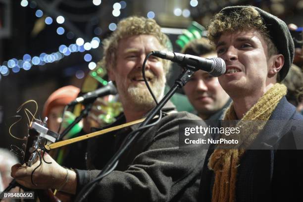 Glen Hansard and David Keenan take part in the annual Christmas Eve busk in aid of the Dublin Simon Community outside the Gaiety Theater in Dublin....