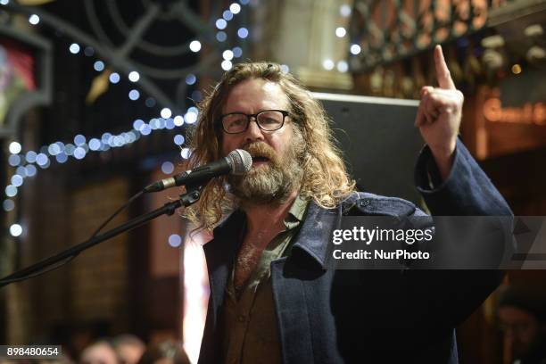 Liam O Maonlai takes part in the annual Christmas Eve busk in aid of the Dublin Simon Community outside the Gaiety Theater in Dublin. Hundreds...