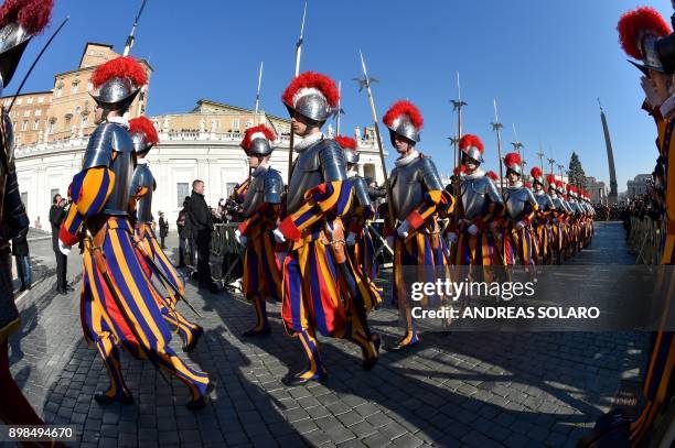 Swiss guards arrive to take position before the traditional "Urbi et Orbi" Christmas address and blessing given to the city of Rome and to the World,...