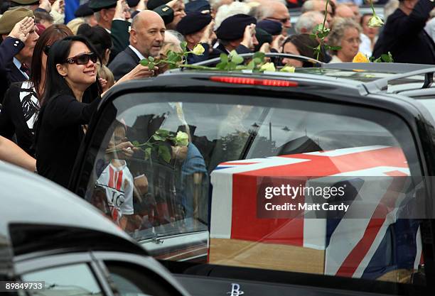 People line the street to pay their respects as hearses carrying the coffins of Lance Bombardier Matthew Hatton Rifleman Daniel Wild and Captain Mark...