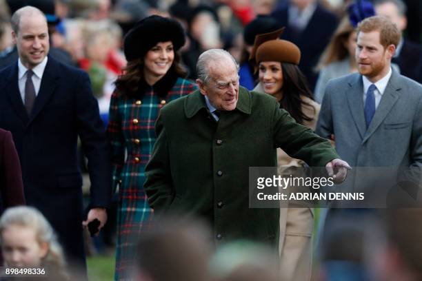 Britain's Prince Philip, Duke of Edinburgh gestures as he is followed by Britain's Prince William, Duke of Cambridge, Britain's Catherine, Duchess of...