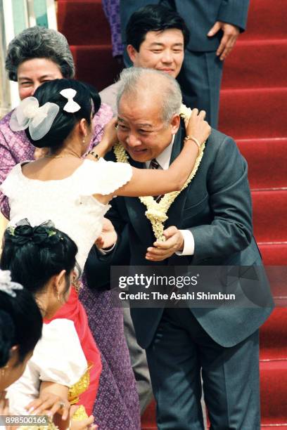 Prince Norodom Sihanouk of Cambodia is welcomed on arrival at Pochentong International Airport on July 7, 1992 in Phnom Penh, Cambodia.