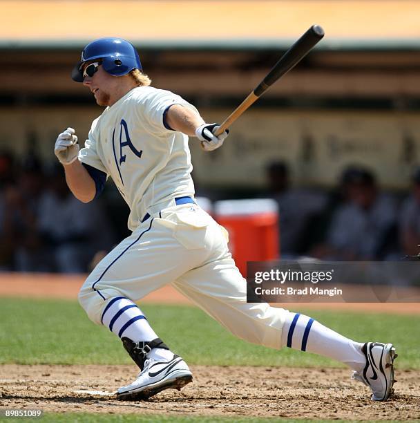 Aaron Cunningham of the Oakland Athletics bats against the Chicago White Sox during the 1929-themed turn back the clock game at the Oakland-Alameda...