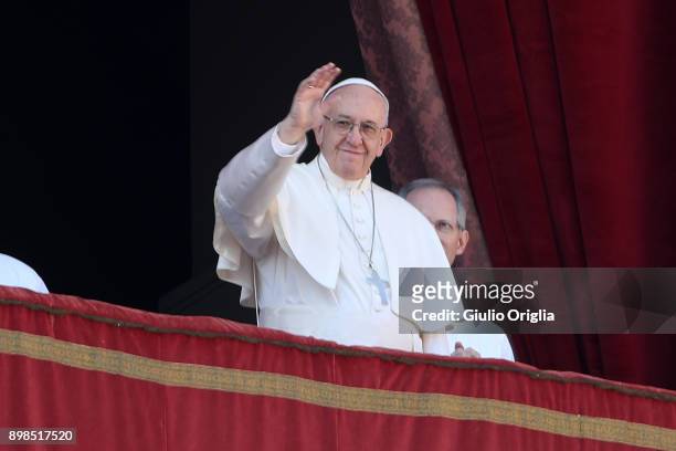 Pope Francis delivers his Christmas Urbi Et Orbi blessing from the central balcony of St. Peter's Basilica on December 25, 2017 in Vatican City,...