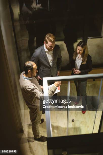 business people in the lobby talking - arial view business meeting stock pictures, royalty-free photos & images