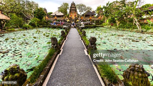 lotus pond and pura saraswati temple in ubud - ubud stock pictures, royalty-free photos & images