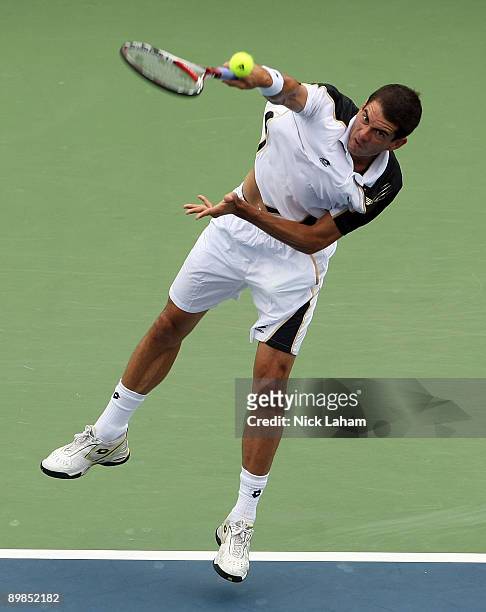 Guillermo Garcia-Lopez of Spain serves against Fernando Verdasco of Spain during day two of the Western & Southern Financial Group Masters on August...