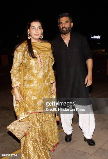 Bollywood actor Suniel Shetty with wife Mana Shetty at wedding reception of Kanchan & Ketan Desais daughter on December 23, 2017 in Mumbai, India.