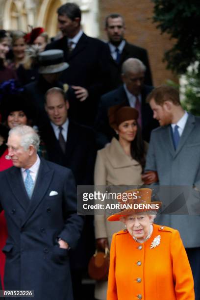 Britain's Queen Elizabeth II leads out the Royal Family as they leave after attending their traditional Christmas Day church service at St Mary...