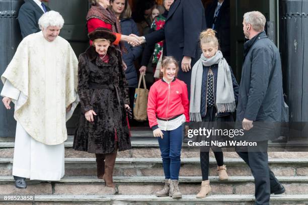 Queen Sonja of Norway, Emma Tallulah Behn of Norway and Leah Isadora Behn of Norway leave the Christmas service at the Holmenkollen Chapel on...