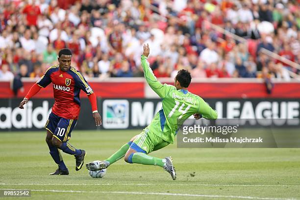 Tyrone Marshall of Seattle Sounders FC goes to block the ball against Robbie Findley of Real Salt Lake at Rio Tinto Stadium on August 08, 2009 in...