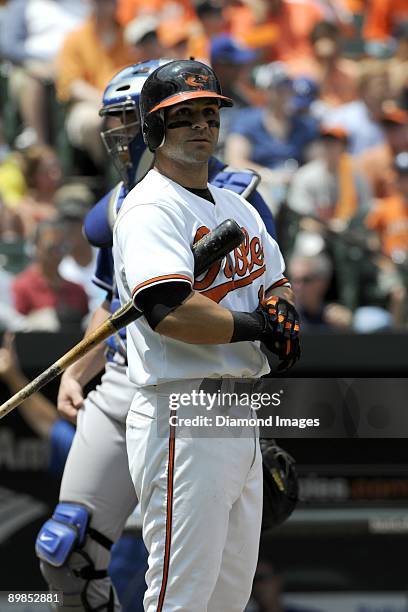 Secondbaseman Brian Roberts of the Baltimore Orioles adjusts his batting gloves during an at bat in the bottom of the third inning of a game on July...