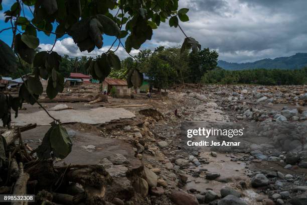 Huge boulders and clay that ran over the village of Mindalano on December 25, 2017 in Salvador, Lanao del Norte, Philippines. Tropical Storm Tembin...