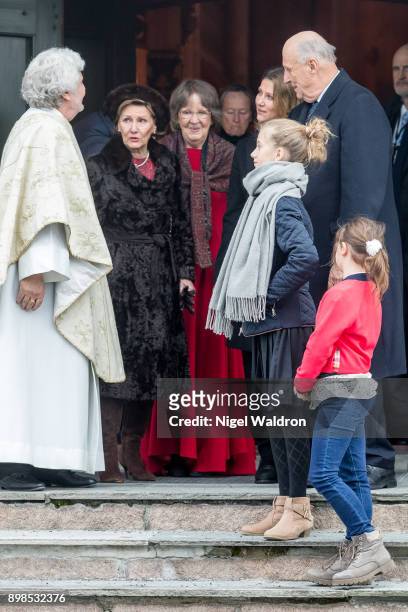 King Harald of Norway, Queen Sonja of Norway chat with the priest Jan Erik Heffemehl of Norway after the Christmas Service at the Holmenkollen Chapel...