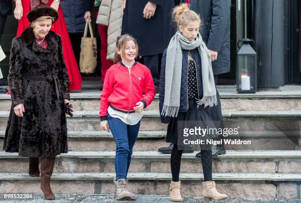 Queen Sonja of Norway, Emma Tallulah Behn of Norway and Leah Isadora Behn of Norway leave the Christmas service at Holmenkollen Chapel on December...